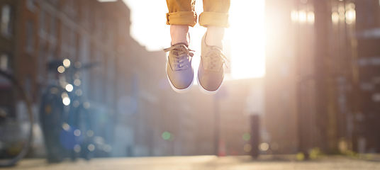 Image showing Feeling light as a feather. a man jumping in joy mid air.