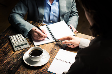 Image showing The place of inspiration. a businessman brainstorming ideas with a coworker.