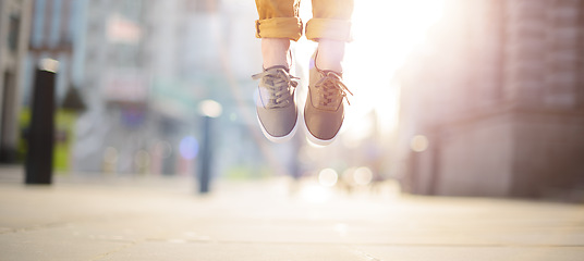 Image showing Jump as high as you can. Hipster man feet jumping concept series.