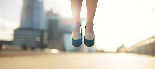 Image showing Expressing happiness in every way possible. a businesswoman jumping in the air.