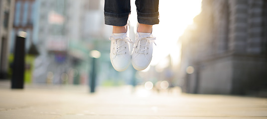 Image showing Can she get any higher. Hipster girl feet jumping concept series.