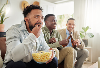 Image showing We enjoying a good movie night now and then. three male friends watching something together while sitting on a couch.