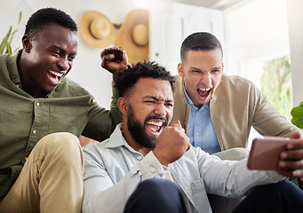 Image showing Check the score on your phone for your convenience. a three male friends looking at something on a cellphone together.