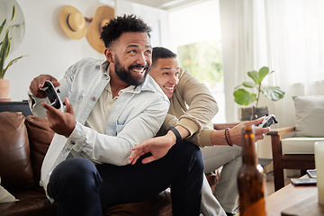 Image showing Stop copying my moves. two men playing video games while sitting on a couch together.