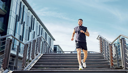 Image showing Dont rush the process, just go with it. Low angle shot of a sporty young man running down a staircase while exercising outdoors.