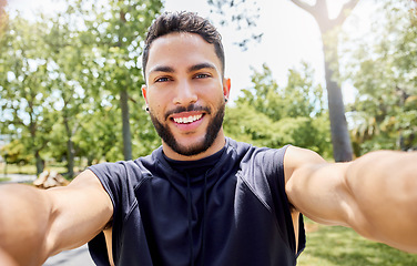 Image showing Its a good day to be out. Portrait of a sporty young man taking selfies while exercising outdoors.