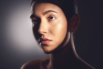 Image showing I have a routine thats dedicated to face time. Studio shot of a beautiful young woman posing with light beam against her face.