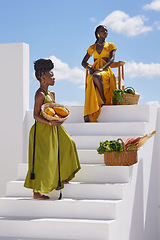 Image showing All flowers are beautiful in their own way. two beautiful women posing on a staircase outside.