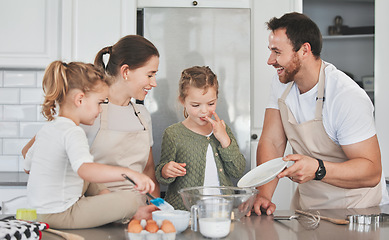 Image showing Cookies are made of butter and love. a family baking together in the kitchen.