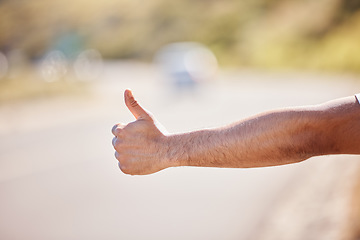 Image showing Anyone care to help. Closeup shot of an unrecognisable man showing thumbs up outdoors.