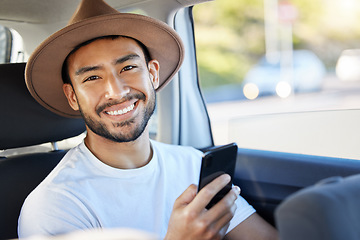 Image showing Look on every exit being an entrance somewhere else. a young man sitting in a car while using his phone.