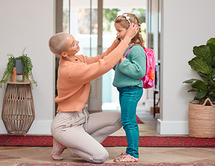 Image showing Its my little girls first day of school. a woman seeing her daughter off before school.