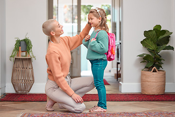 Image showing I cant believe how grown my little girl is. a woman seeing her daughter off before school.