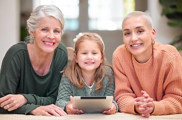 Image showing Little girls rule the world. Portrait of a mature woman bonding with her daughter and granddaughter while using a digital tablet.