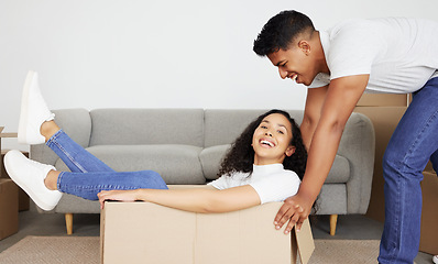 Image showing Can I get a ride. a young couple moving into their new house.