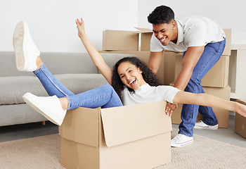 Image showing We love being silly together. a young couple moving into their new house.