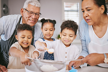Image showing This is going to be extra sweet. a mature couple baking with their grandkids at home.