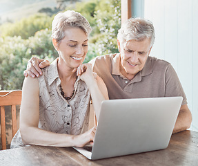 Image showing Im curious to see what you want to show me. a mature couple using a laptop while sitting outside.