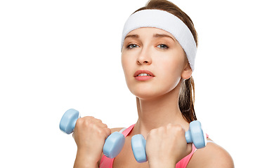 Image showing I wont need your help to life anymore. a young woman using weights against a studio background.