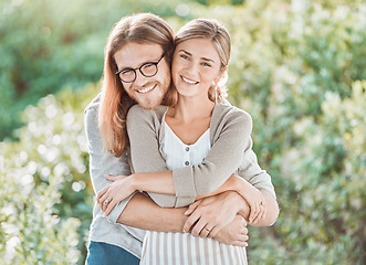 Image showing This love is so peaceful. a young couple spending time together in the garden at home.