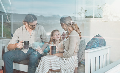 Image showing Theres no better way to spend the day than with my family. a couple drinking coffee while sitting at home with their daughter.