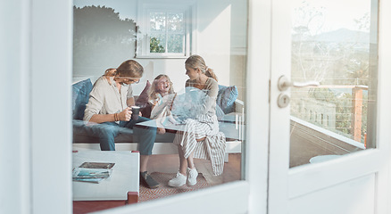 Image showing Seeing her happy brings joy to our hearts. a couple drinking coffee while sitting at home with their daughter.