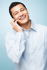 Image showing Never leave without my phone. a young businessman making a phone call against a studio background.