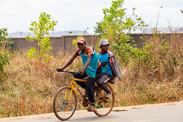 Image showing Two Malagasy men on one bike. Mandoto, Madagascar