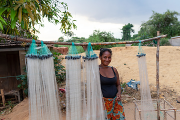 Image showing Malagasy woman selling fishing nets. Miandrivazo, Madagascar