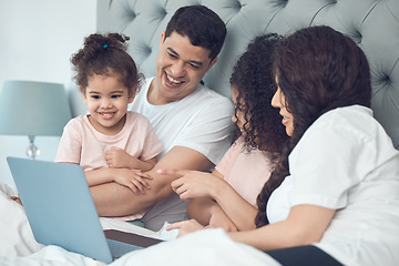 Image showing Treasured family time. a beautiful young family talking and bonding in bed together.