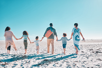 Image showing Come take a walk on the beach with us. a multi-generational family spending the day at the beach.