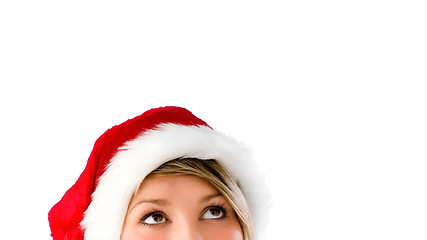 Image showing Woman in christmas hat. Woman in christmas hat thinking