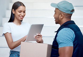 Image showing Looks like everything is here, safe and sound. a young woman using a digital tablet to sign for her delivery from the courier.