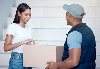 Image showing Feel free to rate our service as well. a young woman using a digital tablet to sign for her delivery from the courier.