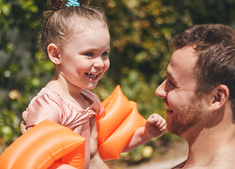 Image showing Daddy ca teach you how to swim. an adorable little learning to swim with her father.