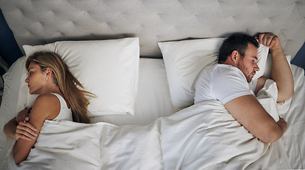Image showing I dont think I want this anymore. a young couple give each other the silent treatment in bed.