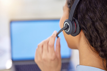 Image showing Call us today for a quote. Closeup shot of a young call centre agent working on a laptop in an office.