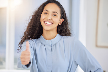 Image showing Give it your best shot. Portrait of a young businesswoman showing thumbs up in an office.