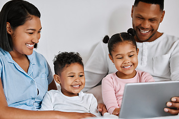 Image showing Our family time is everything. a young family using a digital tablet at home.