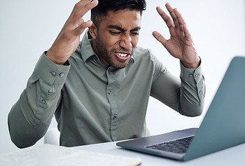 Image showing Oh come on now. a young businessman looking stressed out.