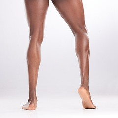 Image showing He NEVER skips leg day. an unrecognizable man showing off his muscular legs while posing against a white background.