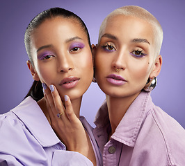 Image showing Theyre giving off purple vibes. two beautiful young women posing in purple.