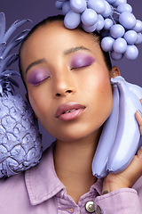 Image showing Im feeling rather purpleish today. Studio shot of a beautiful young woman modelling a purple colour concept.