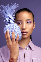 Image showing Soft on the inside and purple on the outside. Studio shot of a beautiful young woman modelling a purple colour concept.