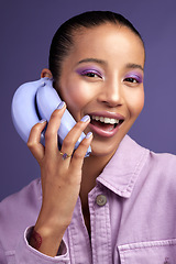 Image showing Calling all purple lovers. Studio shot of a beautiful young woman modelling a purple colour concept.