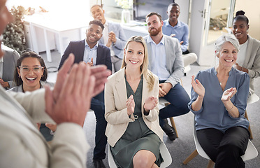 Image showing Put your hands together for that. a group of businesspeople clapping hands in a meeting at work.