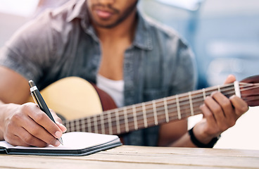 Image showing Composing new music. an unrecognizable man playing guitar.