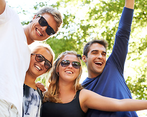 Image showing Rocking out together. Four friends partying and celebrating at a music festival.