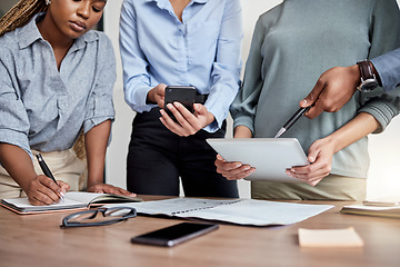 Image showing If anyone can make something out of nothing, its this team. a group of businesspeople brainstorming in the boardroom.