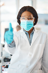 Image showing All is on track with my experiments. Portrait of a young scientist showing thumbs up in a lab.